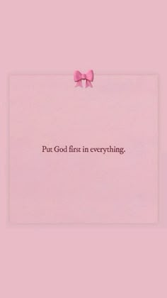 a pink paper with the words put god first in everything and a bow on it