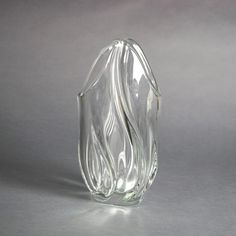 a clear glass vase sitting on top of a table