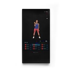 a woman is standing in front of a screen with an exercise program on it's side