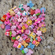 there are many different toys on the counter top in this photo, including buttons and magnets