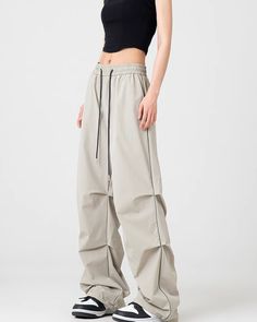 Nylon pants that create a street/mode atmosphere.

The waist is elastic, but the design doesn't make it feel cheap.

It's an orthodox item that can be worn regardless of the season, so it's sure to be useful for many seasons.
◾️Model
Height/Weight：167cm(65.7in)/40kg(88.1lb)
Fitting Size：M





Cm
(inches)

Length
Waist
Hip


S
103.5(40.7)
67(26.3)
109(42.9)


M
105(41.3)
70(27.5)
113(44.4)


L
106.5(41.9)
74(29.1)
121(47.6)


XL
108(42.5)
78(30.7)
125(49.2)


2XL
109.5(43.1)
82(32.2)
129(50.7) Techwear Parachute Pants With Elastic Waistband, Techwear Parachute Pants With Elastic Waistband For Streetwear, High-waisted Drawstring Parachute Pants For Streetwear, High-waisted Parachute Pants For Streetwear, High-waisted Parachute Pants With Drawstring For Streetwear, Straight Parachute Pants With Elastic Waistband For Streetwear, High-waisted Parachute Pants With Elastic Waistband For Streetwear, Wide Leg Nylon Pants For Streetwear, Stretch Wide-leg Parachute Pants For Streetwear