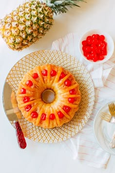 a pineapple bundt cake on a plate with jelly candies next to it