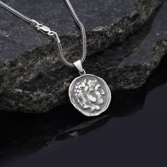 Antique Coin Necklace - Mythology Inspired Sterling Silver - Antique Mythology Jewelry in Sterling Silver -  Boyfriend Gift This product is made of 925 sterling silver.A product that can be used by both men and women.We are very assertive in men's necklaces. The chains and pendants we use while making men's necklaces are of very high quality.The length can be adjustable with an extension (extra chain hoops), please leave a note at check out if you do not want an extension, stating it clearly. ★Item Details * Gender : Male / Female * Material : 925K Sterling Silver * Total weight : 21 Grams ✔ Ready to Ship in 1-2 Business Days .. ✔ Shipped to the Worldwide 1-5 business days with free shipping... ✔ The product will be sent to you with a handmade wooden box to avoid any damage during shipping Mythological Style Round Jewelry Gift, Sterling Silver Coin Shaped Jewelry, Sterling Silver Coin Jewelry In Silver, Sterling Silver Coin Necklace With Symbolic Style, Sterling Silver Engraved Coin Jewelry, Symbolic Sterling Silver Coin Pendant Jewelry, Silver Coin Shaped Sterling Silver Jewelry, Engraved Sterling Silver Coin Jewelry, Symbolic Sterling Silver Coin Jewelry