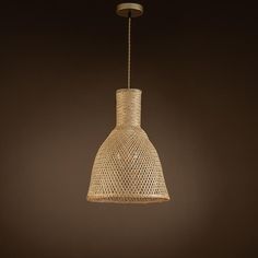 a light that is hanging from the ceiling in a room with brown walls and flooring