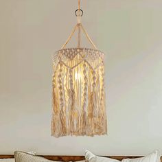 a chandelier hanging from the ceiling in a bedroom