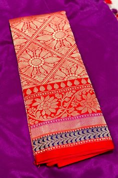 This exquisite handwoven banarasi silk saree in aubergine and red color is nothing but enchanting. Beautiful border with tine beaded lines and traditional motifs accentuates the saree very well. The grand elaborate zari woven pallu is nothing but regal. Blouse is a brocade patterned one. Approximate Length 6.5 mtrs (inclusive of blouse length)Height - 46 - 52" Saree comes with fall, picot and tassels done. Blouse piece is cut. Approximate weight - 1.3 lbs Kindly Note : The colors you see on your device may vary due to the color reproduction, brightness and resolution of individual devices. If you'd like more clarity before your purchase, please contact our support team. Festive Pre-draped Katan Silk Saree With Border, Festive Katan Silk Pre-draped Saree With Border, Festive Katan Silk Pre-draped Saree With Printed Border, Festival Banarasi Silk Pre-draped Saree With Embroidered Border, Red Tussar Silk Pre-draped Saree With Motifs, Silk Cotton Sarees, Blouse Length, Blouse Piece, Cotton Saree