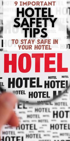 a hand holding a magnifying glass in front of a hotel sign with words on it