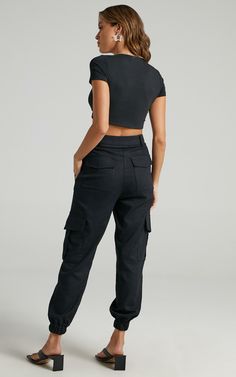 Kayla Cargo Pants in Black | Showpo USA Fitted Cropped Bottoms With Pockets, Chic Cargo Pants With Side Pockets For Streetwear, Chic Streetwear Cargo Pants With Side Pockets, Chic Cropped Bottoms With Pockets, Chic Mid-rise Cargo Style Pants, Trendy Mid-rise Cargo Pants For Workwear, Casual Cropped Pants For Streetwear, Versatile Cropped Workwear Bottoms, Urban High Waist Cargo Pants For Work