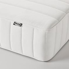 an image of a mattress with no sheets on it