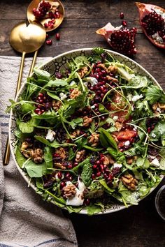 a salad with spinach, feta cheese and pomegranate