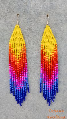 These handmade unique earrings are made of high-quality Czech beads and strong synthetic thread. I use my author's scheme. They are elegant, fashionable, and highly versatile, suitable for everyday wear. There may be some color discrepancies which is due to the different monitor settings. 100% hand made with love! Measurements: Length-about 12cm (4.72 inch) Width -about 2 cm (0.8 inch) Materials: Sterling silver components Czech glass beads Strong bead weaving thread Rainbow Tassel Dangle Earrings, Rainbow Dangle Tassel Earrings, Handmade Multicolor Dangle Tassel Earrings, Handmade Multicolor Tassel Drop Earrings, Summer Multicolor Tassel Earrings With Round Beads, Colorful Handmade Dangle Tassel Earrings, Multicolor Tassel Dangle Earrings With Colorful Beads, Multicolor Beaded Tassel Dangle Earrings, Handmade Multicolor Tassel Earrings With Round Beads