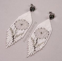 two pairs of white beaded fringe earrings