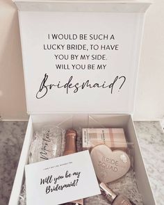 the bridesmaid box is filled with personalized items