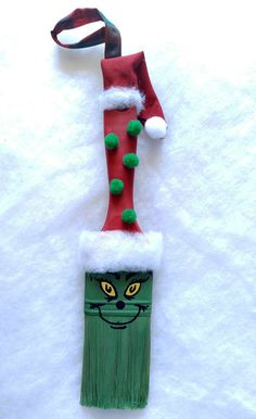 an ornament made to look like a christmas stocking with a cat's head on it