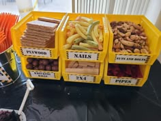 several containers filled with different types of snacks