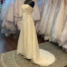 a wedding dress on display in a store