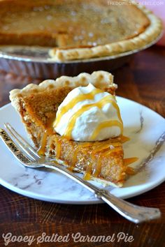 a slice of pie on a plate with a fork and another pie in the background