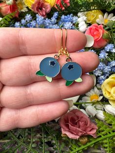 "Blue enamel blueberries with green leaves and golden details.  *Length (using default ear hooks): 1.5\"  *Weight (approx, each): 1.7g ✨Upgradable earring options available are: Gauge sizes are approximate, batches may vary. Some options may be in limited supply and may take additional time to ship.  *304 Steel mini hooks, silver color, 22 gauge (0.7mm). This is the perfect option for anyone with smaller lobes or with low piercings.  *316L Steel hooks, silver color, 21 gauge (0.8mm).  *Golden st Blue Enamel Dangle Jewelry, Blue French Hook Jewelry As Gift, Blue Enamel Hypoallergenic Jewelry, Blue Hypoallergenic Enamel Jewelry, Hypoallergenic Blue Enamel Jewelry, Enamel Drop Earrings With Ear Wire, Nickel-free Blue Enamel Jewelry, Adjustable Enamel Earrings With Ear Wire, Blue Enamel Jewelry With Matching Earrings