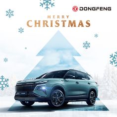 a blue car is parked in front of a christmas tree with snowflakes on it