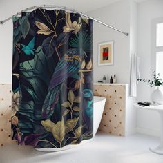 a bathroom with a shower curtain that has an image of a bird on the tree