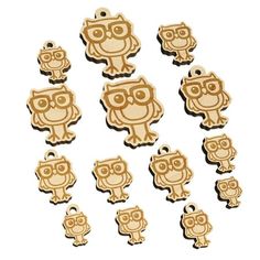 wooden owl charms in various shapes and sizes on a white background with clippings