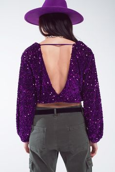 Step into the world of glamour with our dazzling Purple Sequin Top, a perfect choice for your festive and party wardrobe. Eye-Catching Purple Sequins: Embellished with radiant purple sequins, this top adds a splash of color and shimmer to your outfit, making you the center of attention. Flattering V-Neckline: The elegant V-neck design beautifully frames your neckline, adding a touch of sophistication to your party look. Fashion-Forward Balloon Sleeves: The wide balloon sleeves are not only on-tr Party Tops With Lantern Sleeves, Lantern Sleeve Blouse For Fall Party, Party Blouse With Lantern Sleeves For Fall, Purple V-neck Top For Evening, Purple Long Sleeve Evening Blouse, Glamorous V-neck Blouse, V-neck Sequin Blouse For Night Out, Fitted Blouson Sleeve Party Tops, Chic Party Tops With Balloon Sleeves