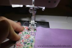 someone is using a sewing machine to sew something