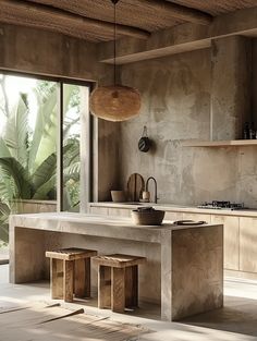 a modern kitchen with an island countertop and stools in front of the window