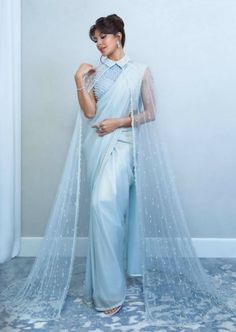 This beautiful sari set has a crystal embellished high neck blouse with a sari and cape embellished with crystals. College Farewell Saree Ideas, Diwali Fits, Bride Sarees, Farewell Saree, Modern Sarees, Unique Saree, Reception Sarees, Saree Wearing Styles, Simple Saree Designs