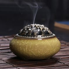 a golden bowl with steam rising from it