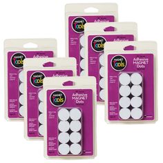 four pack of white round magnets in packaging