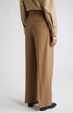 Topstitch detailing subtly calls out the classic lines of these pleated wide-leg trousers tailored from organic cotton in NYC. 30 1/2" inseam; 22" leg opening; 14 1/2" front rise; 16" back rise (size 8) Zip fly with hook-and-bar closure Front slant pockets; back welt pockets 100% organic cotton Hand wash, line dry Made in the USA of imported fabric Designer Clothing Classic Wide Leg Pants For Spring, Classic Wide Leg Pants With Relaxed Fit, Elegant Formal Bottoms With Seam Detailing, Timeless Wide Leg Bottoms With Welt Pockets, Spring Classic Full Length Wide Leg Pants, Seam Detailed Pants For Workwear, Solid Color Wide Leg Business Pants, Classic Brown Wide Leg Pants For Office, Business Wide Leg Pants