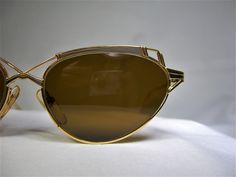 "Total optical sophistication amalgamated with highest quality craftsmanship and materials from prestigious Swiss designer Roman Rothschild, an extremely rare pair of sunspecs, much sought after by collectors and wearers alike. Model R1049, size 130-52[]17, hinge to hinge inside width 135mm (5.31 inches), extremely limited \"Precious Metals\" edition. Entirely hand made ultra-light (weighing only 27 grams, lenses included) Gold and Platinum plated Titanium alloy frame, superb Art Deco modernist Vintage Gold Aviator Sunglasses With Uv Protection, Gold Anti-reflective Shield Sunglasses, Vintage Gold Rectangular Sunglasses, Modern Gold Aviator Sunglasses With Anti-reflective Coating, Cheap Gold Aviator Sunglasses With Anti-reflective Details, Luxury Eyeglasses, Star Vintage, Gold Sunglasses, Eyeglasses Frames