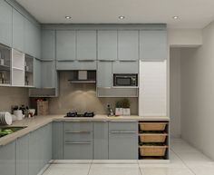 a kitchen with gray cabinets and white flooring, including an open drawer for food