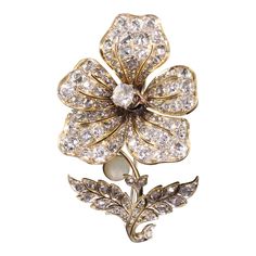 Beautiful Antique Victorian 18K Yellow Gold Old Mine Diamond En Tremblant Flower Pin. This gorgeous flower pin is crafted in 18k yellow gold with a white gold clasp. The flower has old mine cut diamonds set all over the flower. Some of the petals have movement to them as they are on hinges. The pin is in good condition and is ready to be worn. Item #P0174 Metal: 18K Yellow Gold Weight: 12.4 Grams Size: 2 inches long and 1 1/4 inches wide Diamonds: Approximately 4.5 cts Color: H - J Clarity: VS2 - SI1 Measurements: The pin measures 2 inches long and 1 1/4 inches wide. Layaway: For your convenience, we will be happy to provide layaway payment options. Please contact us to work out a layaway plan which best suits your needs. All layaway purchases are final sale. All domestic and international Flower Pins, Antique Art Deco, Gold Platinum, Cool Suits, Antique Victorian, Antique Art, Diamond Cuts, Platinum, Art Deco