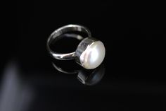 Real pearl ring, Set in sterling silver, This freshwater pearl is White or cream color. This round pearl ring can be an engagement to cocktail ring. This Pearl Ring on Etsy is made to size. The Pearl is Birthstone for June. It's cream color represents purity, generosity, integrity and loyalty. Though classified as a gemstone, pearls are extremely unique, largely due to the fact that they are the only gem material formed and found within a living creature. ... A large amount of nacre that forms a White Solitaire Pearl Promise Ring, Pearl White Rings With Pearl Charm For Anniversary, Anniversary Pearl White Rings With Pearl Charm, Anniversary Rings In Pearl White With Pearl Charm, White Pearl Drop Ring For Anniversary, Wedding Pearl Rings With Pearl Pendant, White High Luster Pearl Ring For Wedding, Minimalist Silver Pearl Wedding Ring, Sterling Silver Solitaire Pearl Ring For Anniversary