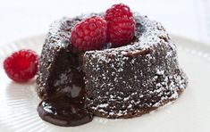 a piece of chocolate cake with raspberries on top