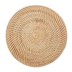 a round woven placemat on a white background