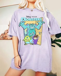 Vintage Disney Pixar Monsters Inc T Shirt Character Print T-shirt For Disney Fan Events, Disney Pre-shrunk Short Sleeve T-shirt, Disney Short Sleeve Pre-shrunk T-shirt, Disney Themed Short Sleeve T-shirt, Disney T-shirt With Front Print, Disney T-shirt With Front Print For Fan Events, Disney Fan Apparel T-shirt With Short Sleeves, Disney Graphic Print T-shirt For Fans, Disney Fan Merchandise Top, Pre-shrunk