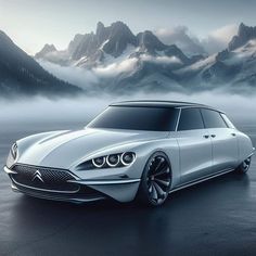 the concept car is shown in front of mountains and foggy sky with low clouds