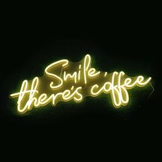 a neon sign that says smile there's coffee