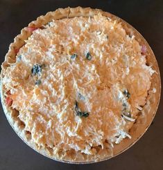 an uncooked pie sitting on top of a table