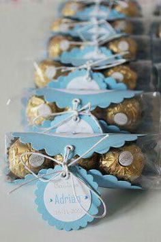 some chocolates are wrapped in celloine and tied to the side with tags on them