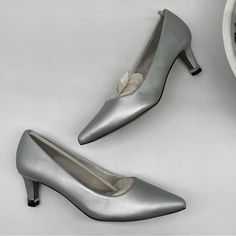 Easy Street Women’s Silver Satin Pointed Toes Padded Heels Dance Flex Size 6.5w 2.25" Dress Heel, Classic Pump Easy Flex Outsole Classic Dress Heel With A Fashionable Rand Sleek Pointed Toe Silhouette Heel To Toe Padded Insole Please Refer To Pictures For Details. Bundle And Save!!! Offers Welcome :) Silver 0239 Silver Fitted Low Heel Heels, Silver High Heel Court Shoes With Medium Width, Silver High Heel Court Shoes Medium Width, Silver Closed Toe Court Shoes Medium Width, Synthetic Round Toe Kitten Heels For Formal Occasions, Silver Pointed Toe Heels Medium Width, Silver Heels With Medium Width And Pointed Toe, Silver Fitted Block Heel Heels, Fitted Synthetic Kitten Heels With Round Toe