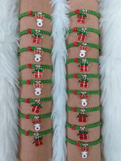 a pair of stockings with christmas decorations on them sitting on top of a fur covered floor