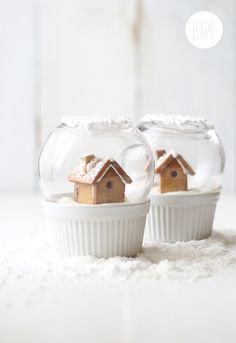 two small houses are in a bowl with snow on the ground and one is inside