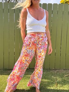 Ditch those boring trousers and upgrade to our Tulip Gardens beach pants! Featuring a flared leg and unique split tulip hem, these printed pants will have you turning heads. Made with 100% rayon for a comfortable and stylish fit. Get ready to stand out in these fun and playful pants! Summer Vacation Boho Print Bottoms, Summer Beach Boho Print Bottoms, Summer Floral Print Wide Leg Pants, Casual Boho Print Bottoms For Beach, Summer Floral Print Wide-leg Pants, Summer Wide Leg Floral Print Pants, Summer Wide Leg Pants With Floral Print, Floral Print Wide Leg Pants For Day Out, Bohemian Floral Print Bottoms For Vacation