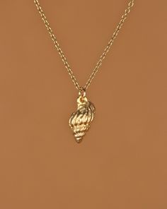 Conch shell necklace - gold shell necklace - beach necklace - a 14k gold vermeil spiral shell on a 14k gold filled chain This simple and classy little gold vermeil spiral conch shell hangs from a 14k gold filled chain in the length of your choice!  Feel free to select a different length if you prefer!  This beauty is also available in sterling silver :)  This shell charm measures 10mmx6mm. You can also add a little tourmaline drop if you like! https://www.etsy.com/listing/156969259/tourmaline-dr Dainty Gold Shell Charm Necklace, Gold Shell Necklace, Spiral Shell, Beach Necklace, Beach Necklaces