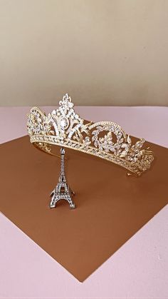 Our REALE Wedding Tiara is Handcrafted with Swarovski Crystals and Exquisite Details. REALE is truly a gorgeous breathtaking Wedding or Quinceanera Tiara. An absolute stunner, the sparkle is just amazing and REALE is fit for a princess on her wedding or special day. Handcrafted Highest Quality Swarovski / Cubic Zirconia Platinum plated Guards against scratches and tarnish. approximate size 2.5" tall approximate weight: 4.81 oz Full Circle Crown, Quinceanera Tiaras, Quinceanera Crown, Crystal Wedding Tiaras, Wedding Tiaras, Silver Tiara, Boutique Couture, Luxurious Wedding, Breathtaking Wedding