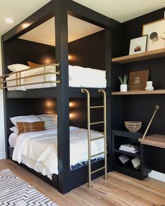 a bedroom with bunk beds and shelves on the wall